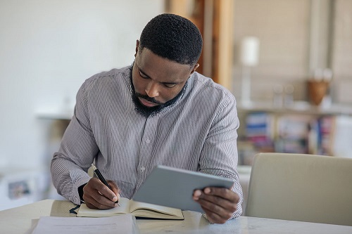 Man studying using ipad